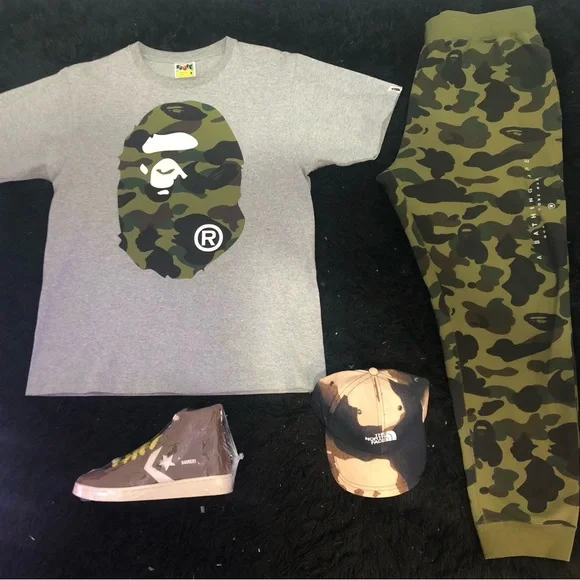 A BATHING APE GREEN 1ST CAMO SWEATS W/ EMBROIDERED LETTERS IN WHITE SZ. M